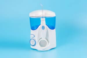 electronic tooth irrigator personal home usage blue background Blog