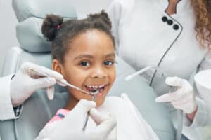 happy afro kid regular check up teeth dental clinic 1 Blog
