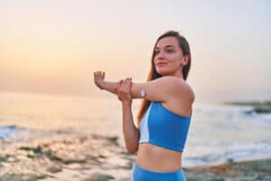satisfied one fitness slim diabetic patient woman doing hands stretching exercises by sea healthy habits active sugar diabetes lifestyle Blog